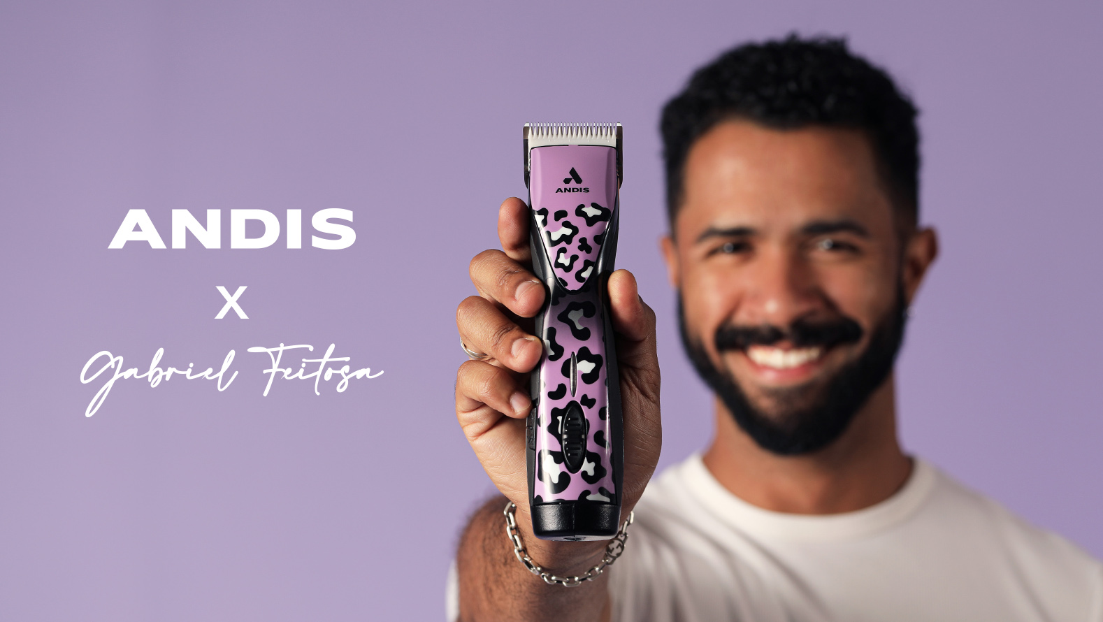 Gabriel Feitosa holding a purple Andis Supra clipper