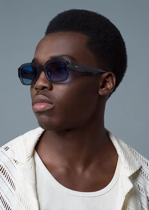 Male model shows off stylish Sculpted Tapered Afro hairstyle.